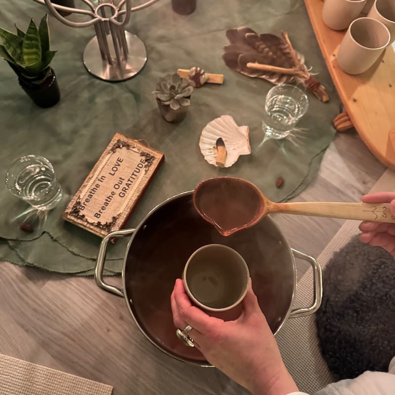 Pouring cacao in a cup